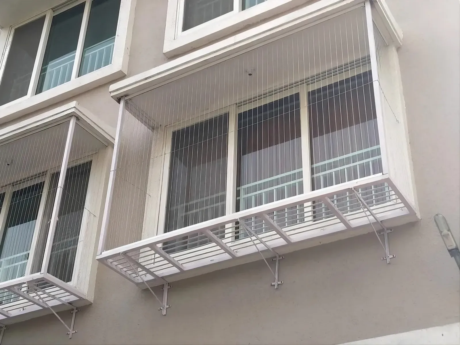 Invisible grills installed across apartment windows